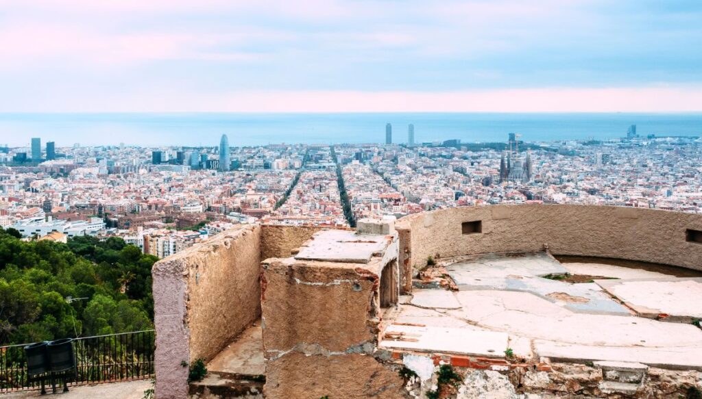Historic ruins of a cement platform that offers epic Barcelona views at sunset from Bunkers del Carmel in Barcelona. 