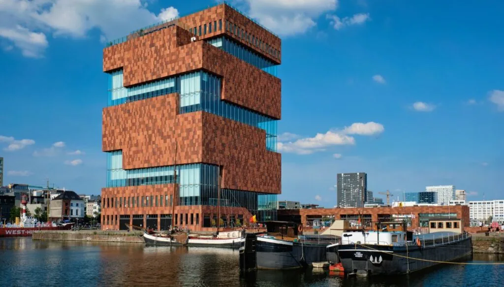 The modern, brick, square building that is the MAS Museum on the water in Antwerp. It has some of the best views in Antwerp. 