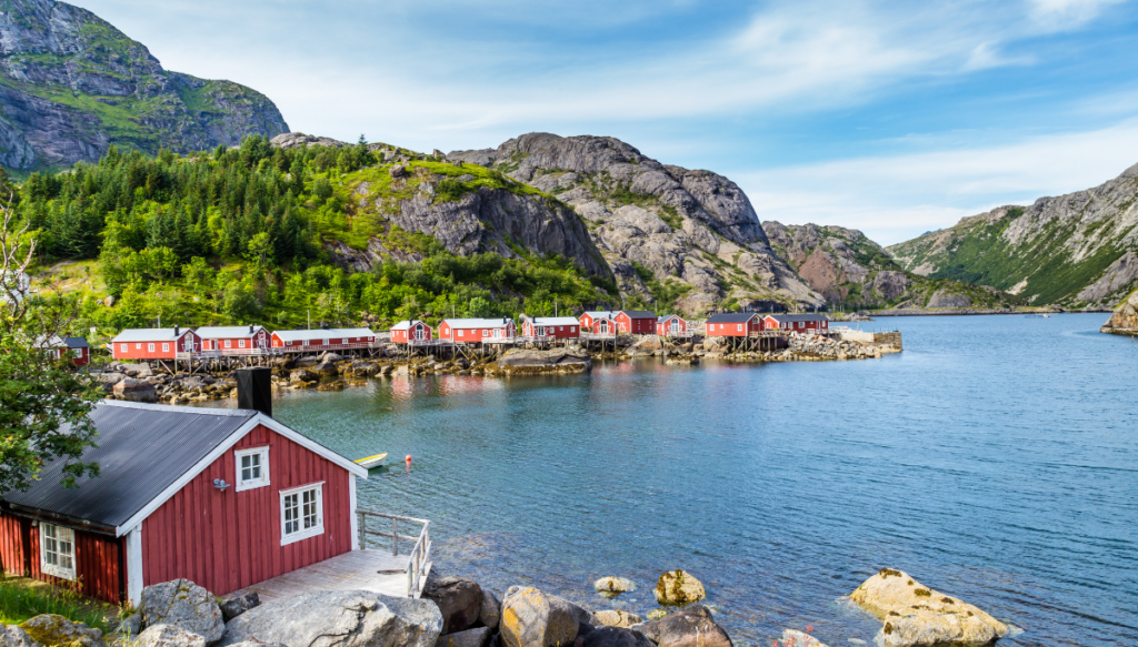 Historic red homes surround the water and the fjord of Nusfjord. This is one of the best villages in Norway. 