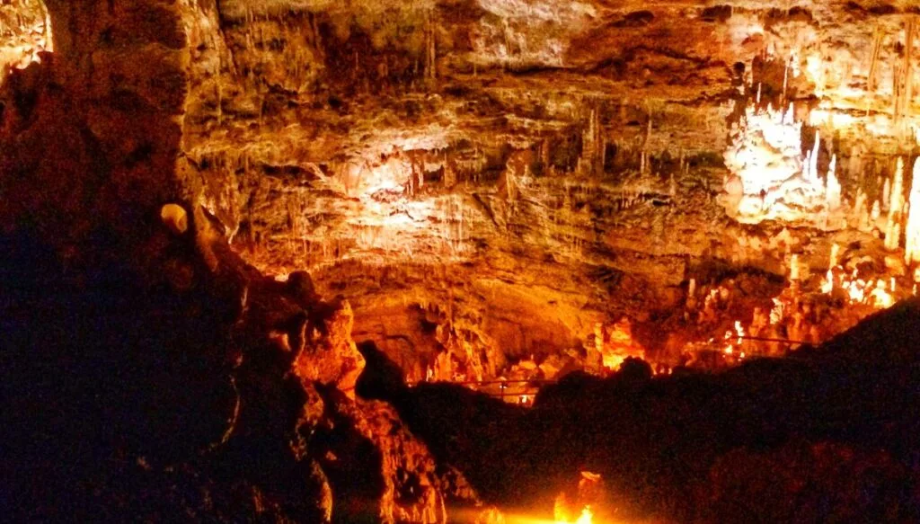 View of the deep caverns that are filled with spiky rocks and all lit up inside the Caverns of Sonora. 