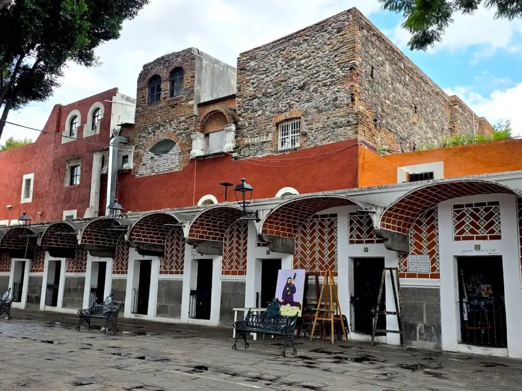 View of art on display from small galleries lining the streets of Barrio del Artista in Puebla. 