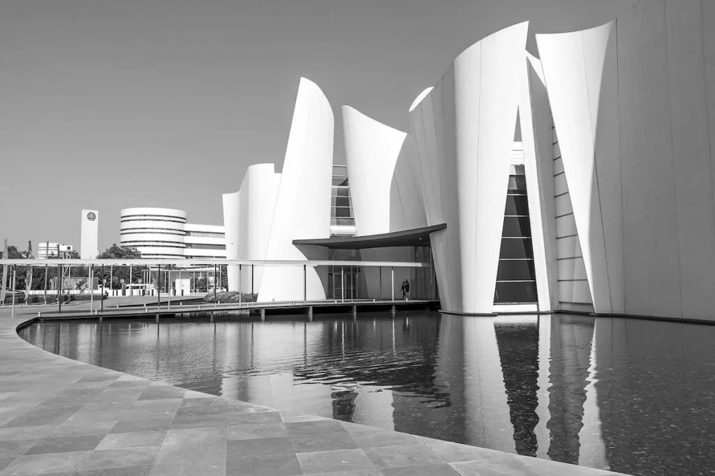 Black and white photos of the modern looking entrance to the International Baroque Museum in Puebla. 
