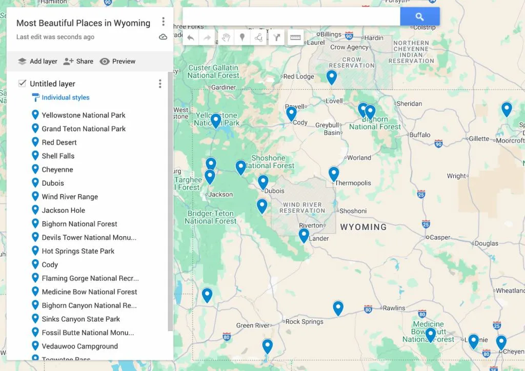View of a map of Wyoming with blue dots to represent the most beautiful places in Wyoming. 