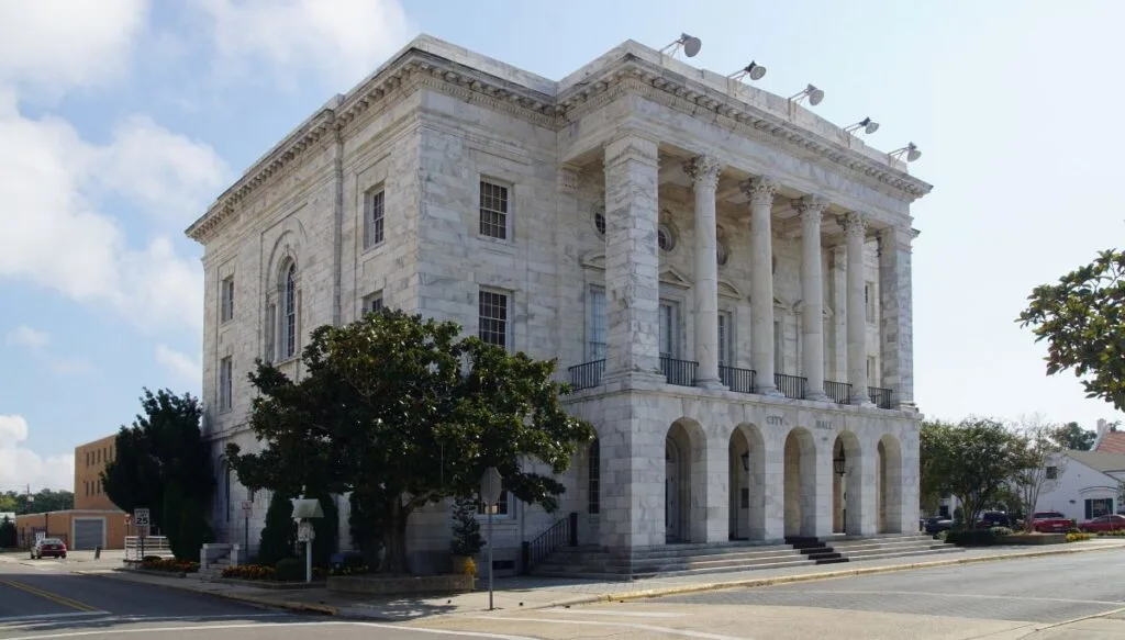 View of a gray stone home with columns out front in Biloxi Mississippi. 