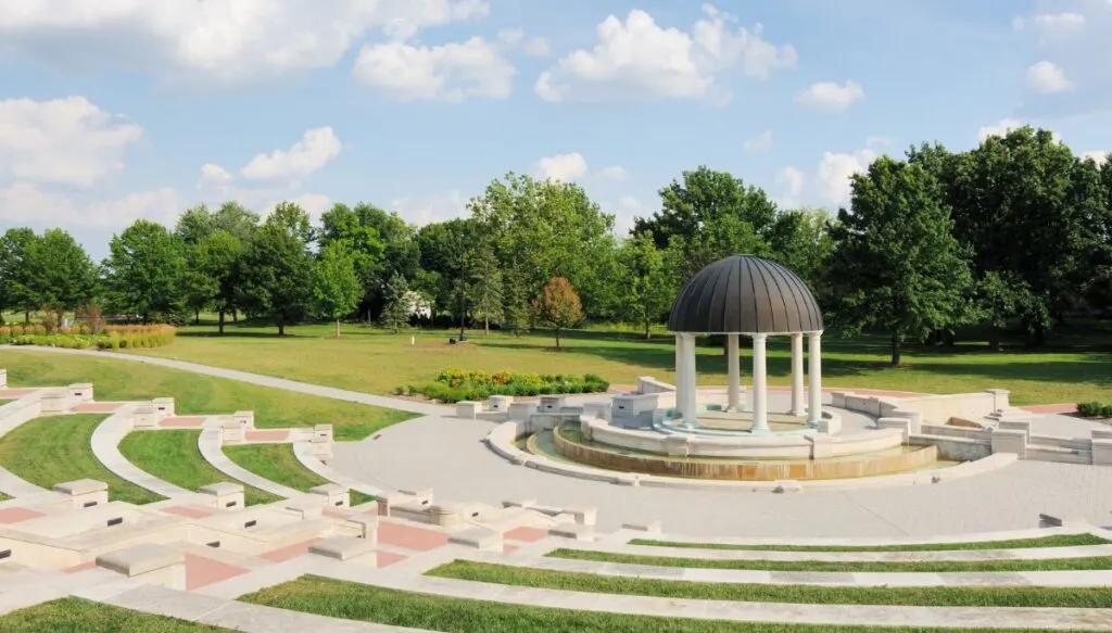 View of an open-air pavilion surrounded by white marble in Coxhall Gardens in Indiana. 
