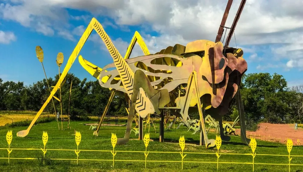 View of a giant grasshopper sculpture along the edge of the Enchanted Highway. This is one of the most beautiful places in North Dakota.