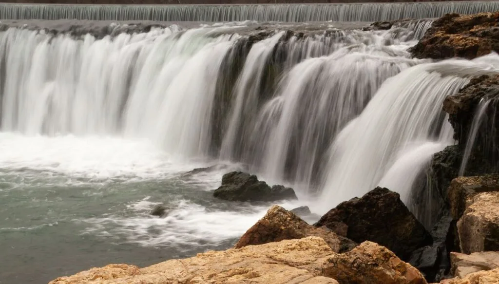 View of Grand Falls tumbling down some rocks in Missouri. 