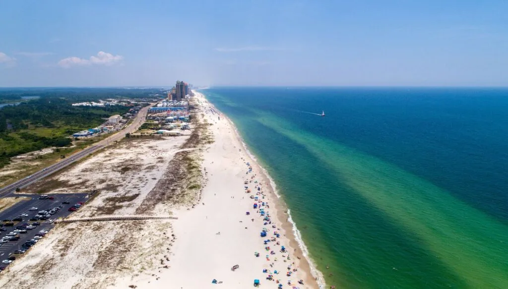 Aerial view of the white sand beaches along the ocean in Gulf Shores Alabama. 