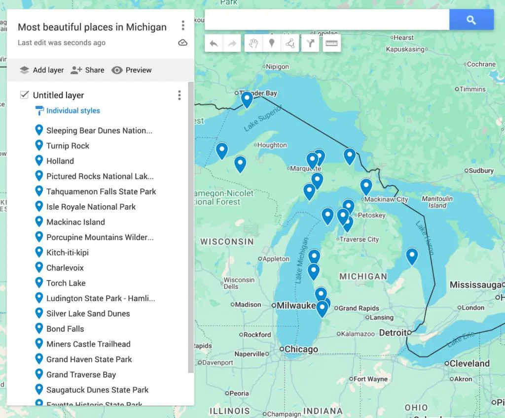Map of Michigan with 19 blue dots to represent all pf the most beautiful places in Michigan. 