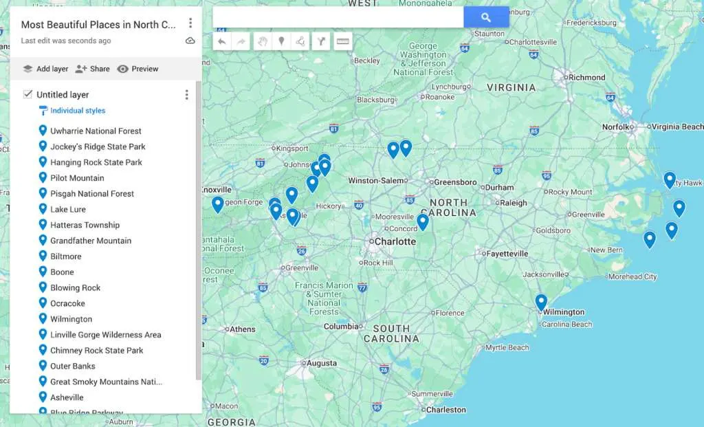 View of a map of North Carolina with 19 blue dots to represent the most beautiful places in North Carolina right now. 