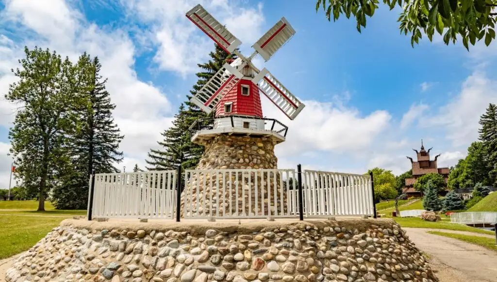 View of a small red windmill on a stone pedestal inside of Scandinavian Heritage Park. This is one of the most beautiful places in North Dakota.