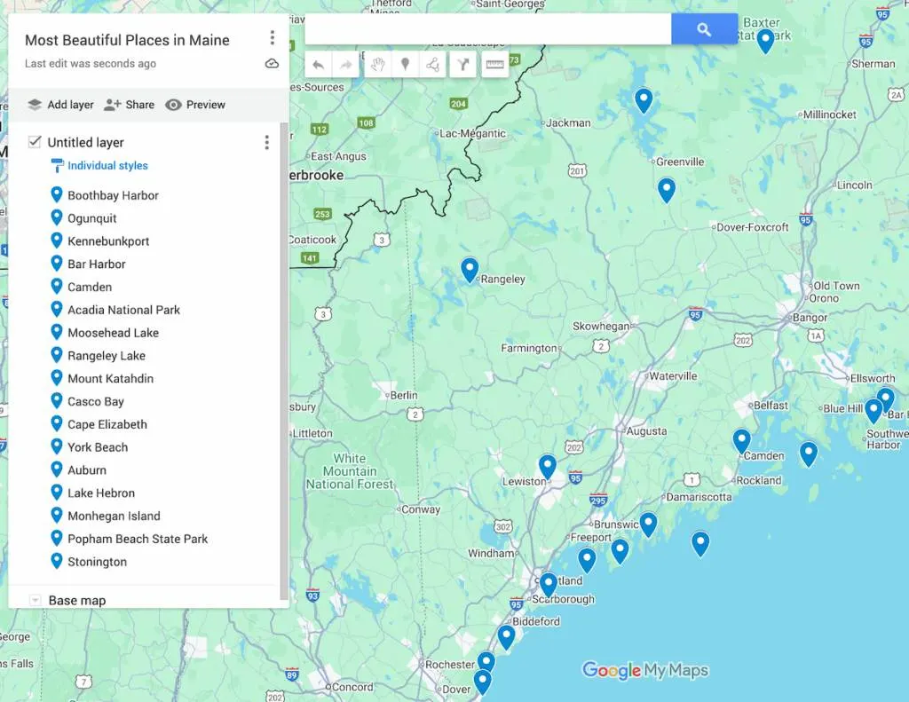 View of  a map of Maine with 17 blue dots to represent the most beautiful places in Maine. 