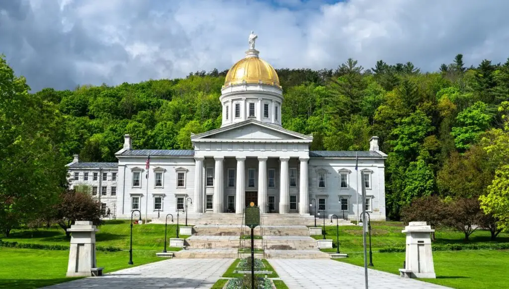 View of the state capitol building in Montpelier. You can see the golden dome and white columns out front. 