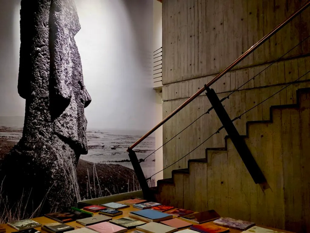 View of a photo is a head from Easter Island in the background and the stairs in the right in the Centro de Imagen.  