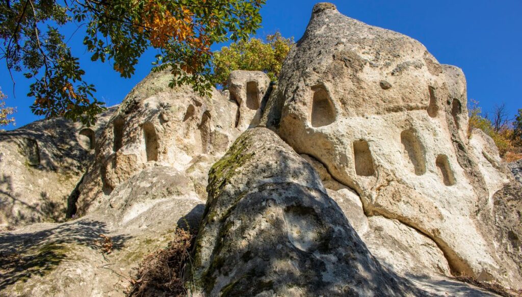 View of the Bukk Mountains and white stones with beehive stones on a sunny day in Hungary.