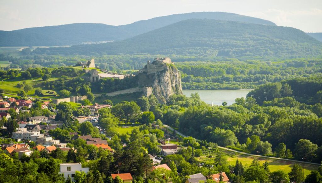 Panoramic view of Bratislava and Devin Castle sitting high on an outcropping of rocks overlooking the river.